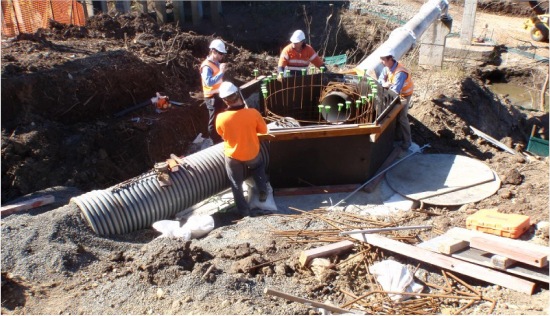 Team installing drainage infrastructure on site
