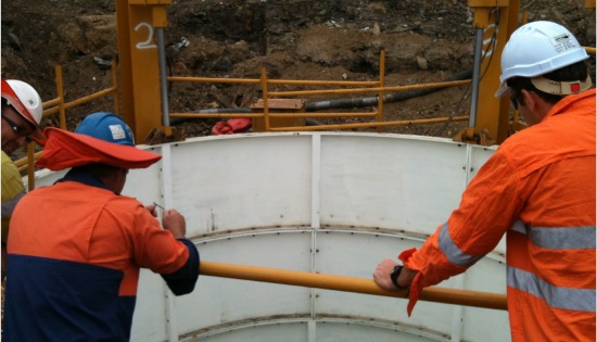 Crew members working together on a shaft installation